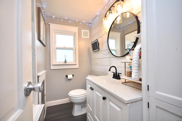 30 Taylor St, Windsor, CT 06095 - bathroom with vanity, wood finished floors, toilet, and baseboards