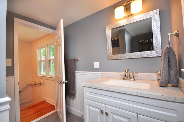 30 Taylor St, Windsor, CT 06095 - bathroom featuring vanity, wainscoting, and tile patterned flooring