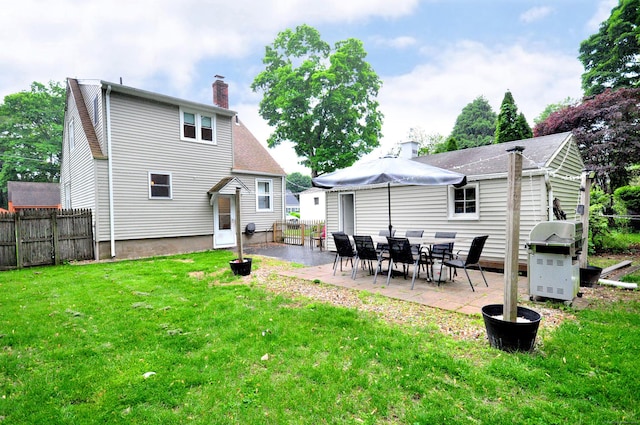 30 Taylor St, Windsor, CT 06095 - rear view of house with a patio and a chimney