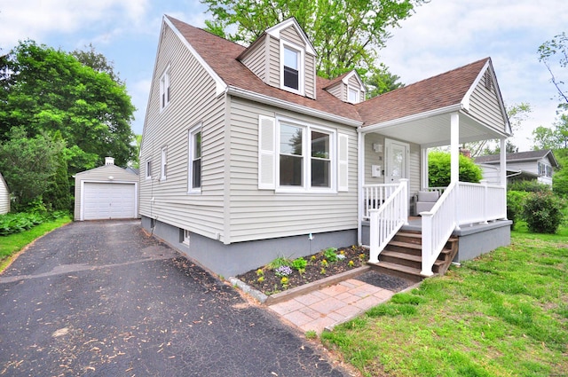 30 Taylor St, Windsor, CT 06095 - view of front of property with an outdoor structure, driveway, a garage, a front yard, and a shingled roof