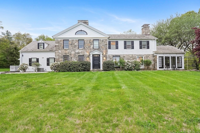 20 Fieldstone Dr, Easton, CT 06612 - view of front facade with a chimney, stone siding, and a front yard