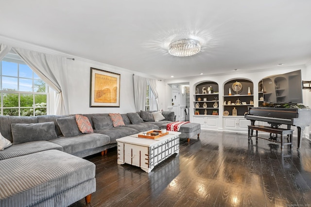 20 Fieldstone Dr, Easton, CT 06612 - living area with healthy amount of natural light, hardwood / wood-style flooring, built in shelves, ornamental molding, and a chandelier