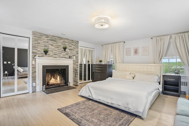 20 Fieldstone Dr, Easton, CT 06612 - bedroom featuring a fireplace, wood-type flooring, and radiator