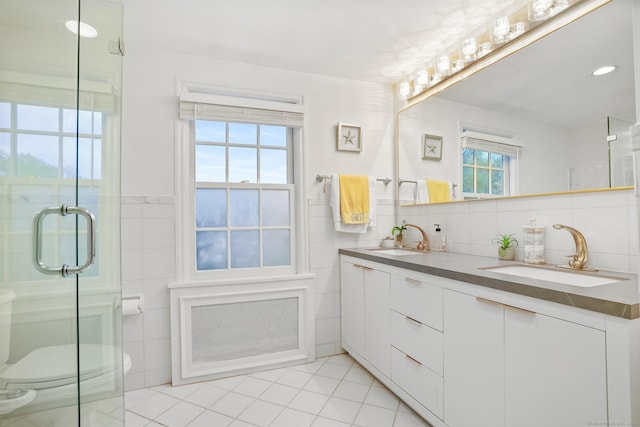 20 Fieldstone Dr, Easton, CT 06612 - full bath with tile walls, tile patterned floors, a stall shower, double vanity, and toilet