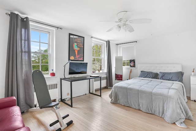 20 Fieldstone Dr, Easton, CT 06612 - bedroom with radiator heating unit, hardwood / wood-style floors, multiple windows, and ceiling fan