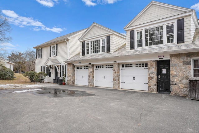 20 Fieldstone Dr, Easton, CT 06612 - townhome / multi-family property with stone siding, driveway, and a garage