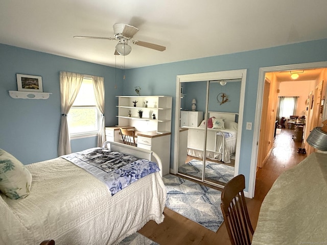 bedroom featuring wood finished floors and a ceiling fan