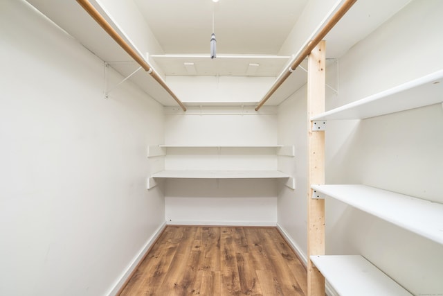 spacious closet with wood finished floors