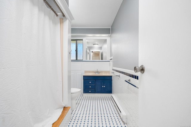 full bath featuring toilet, crown molding, tile walls, vanity, and a shower with curtain