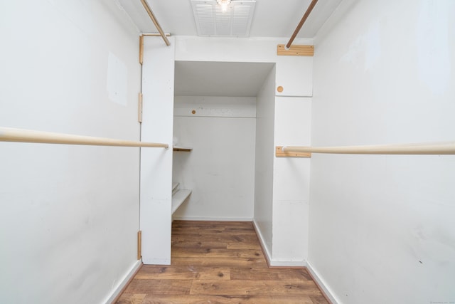spacious closet with wood finished floors