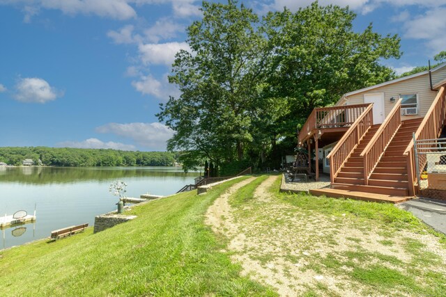 44 Laurel Point Dr, Montville, CT 06370 - view of grassy yard with stairway, a deck with water view, and a dock