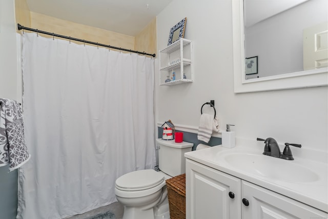 full bath featuring toilet, vanity, and curtained shower