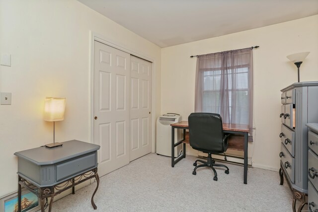 home office featuring light carpet and a baseboard radiator