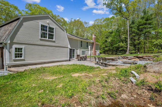 138 Flood Rd, Marlborough, CT 06447 - back of house featuring a patio area, a gambrel roof, and a yard