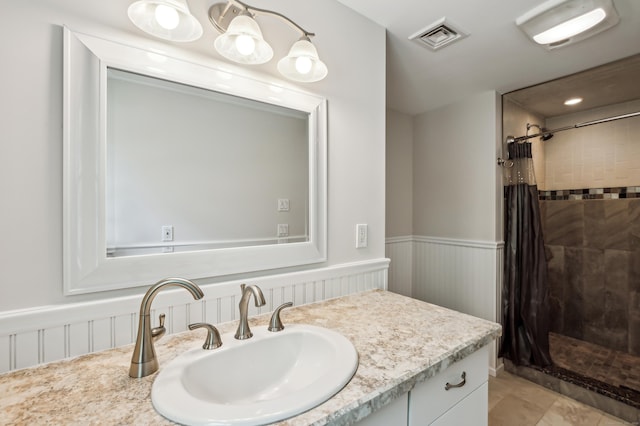 138 Flood Rd, Marlborough, CT 06447 - full bath with wainscoting, a tile shower, and vanity