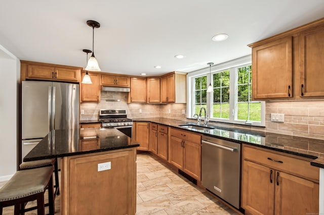 138 Flood Rd, Marlborough, CT 06447 - kitchen featuring a sink, appliances with stainless steel finishes, under cabinet range hood, backsplash, and dark stone countertops
