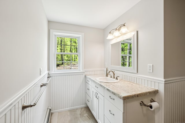 138 Flood Rd, Marlborough, CT 06447 - bathroom featuring wainscoting, plenty of natural light, vanity, a baseboard heating unit, and marble finish flooring