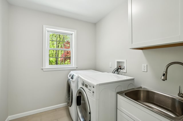 138 Flood Rd, Marlborough, CT 06447 - laundry room featuring cabinet space, separate washer and dryer, light tile patterned floors, and baseboards