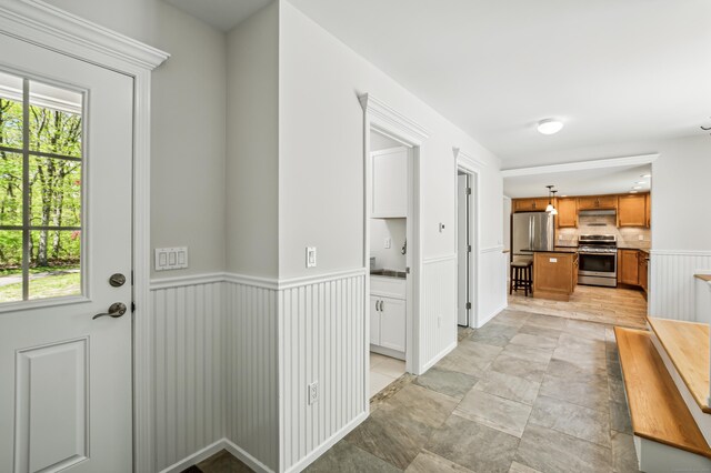 138 Flood Rd, Marlborough, CT 06447 - hallway with healthy amount of natural light and a wainscoted wall