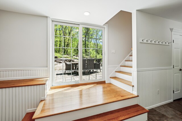138 Flood Rd, Marlborough, CT 06447 - stairs featuring radiator, wood finished floors, and a wainscoted wall