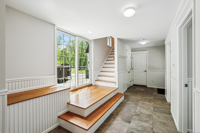 138 Flood Rd, Marlborough, CT 06447 - stairs with a wainscoted wall and stone finish flooring