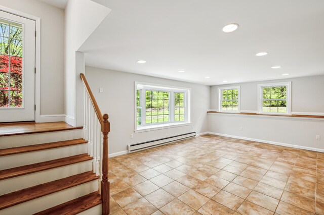 138 Flood Rd, Marlborough, CT 06447 - empty room with a baseboard heating unit, stairs, recessed lighting, light tile patterned flooring, and baseboards