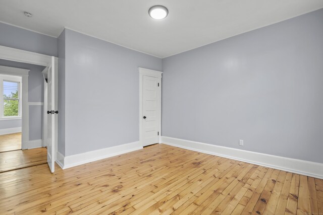669 Third Ave, West Haven, CT 06516 - unfurnished room featuring baseboards, light wood-type flooring, and a smoke detector
