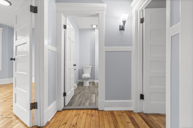 669 Third Ave, West Haven, CT 06516 - bathroom featuring toilet, wood-type flooring, and baseboards