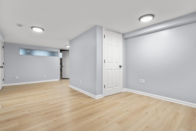 669 Third Ave, West Haven, CT 06516 - finished below grade area with light wood-type flooring and baseboards
