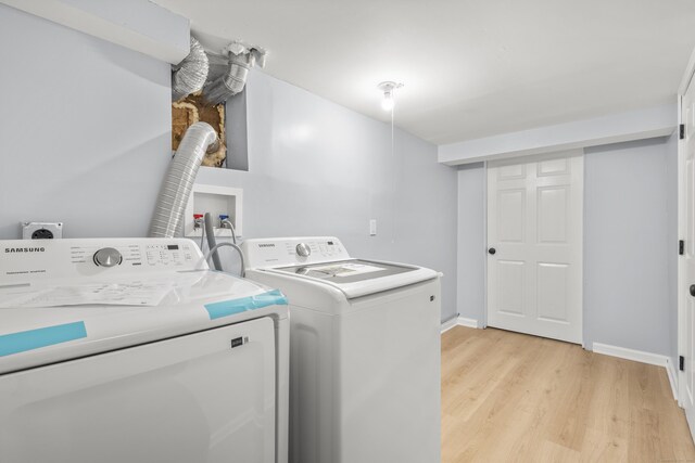 669 Third Ave, West Haven, CT 06516 - clothes washing area with separate washer and dryer, light wood-style flooring, and baseboards