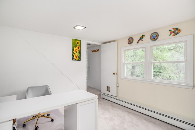 office space with a baseboard radiator and light carpet