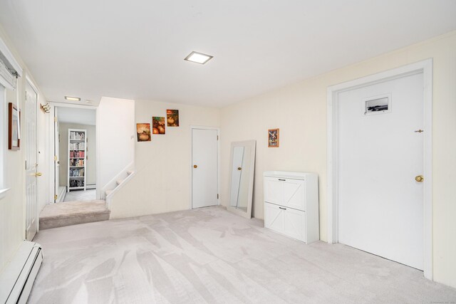 garage featuring a baseboard heating unit