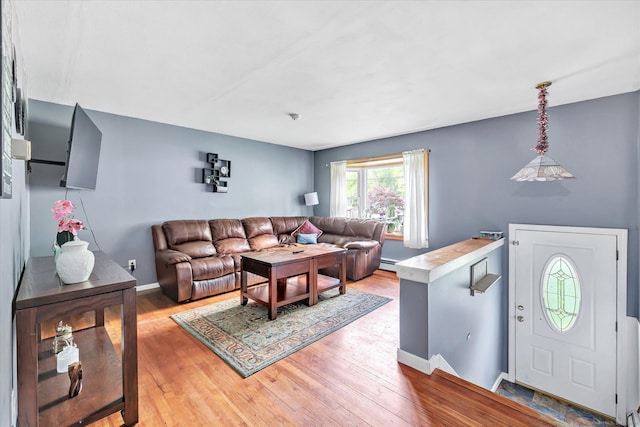 2 Chestnut Ct, Seymour, CT 06483 - living area with wood finished floors, baseboards, and baseboard heating