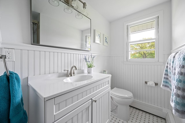 14 Arnold Ln, Norwalk, CT 06853 - bathroom with a baseboard radiator, wainscoting, toilet, and vanity