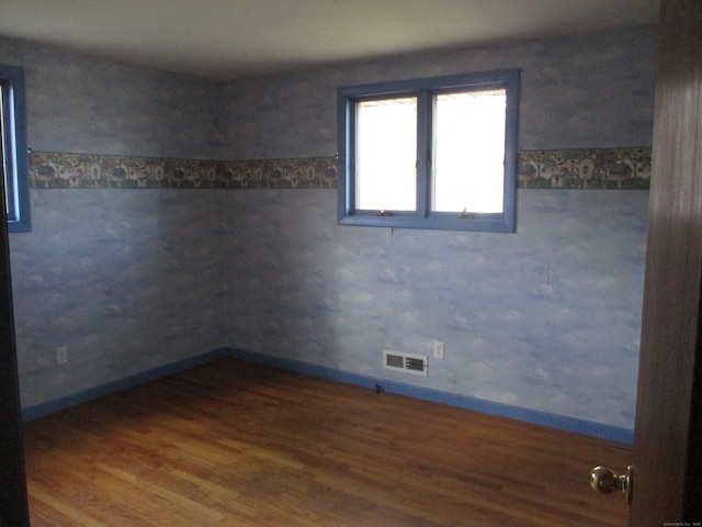 empty room featuring wood finished floors