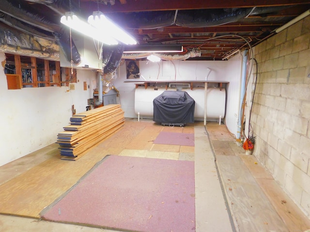 29 Barholm Ave, Stamford, CT 06907 - unfinished basement with oil tank and concrete block wall
