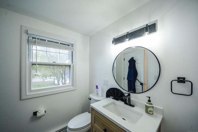 bathroom featuring toilet and vanity