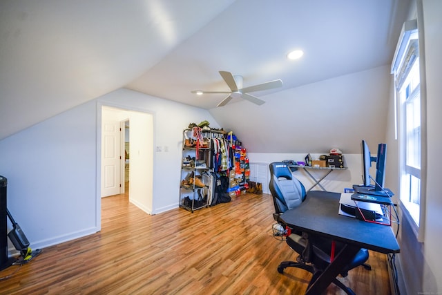 office space with wood finished floors, a ceiling fan, vaulted ceiling, and baseboards