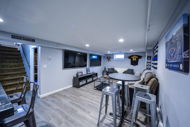 dining area featuring recessed lighting, stairway, wood finished floors, and baseboards