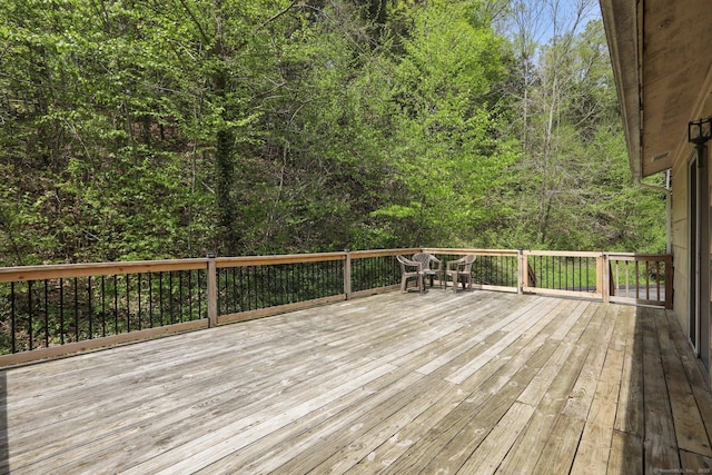 deck featuring a forest view