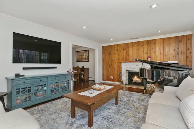 9 Cindy Ln, Norwalk, CT 06851 - living area with wood finished floors, crown molding, wooden walls, a fireplace, and recessed lighting