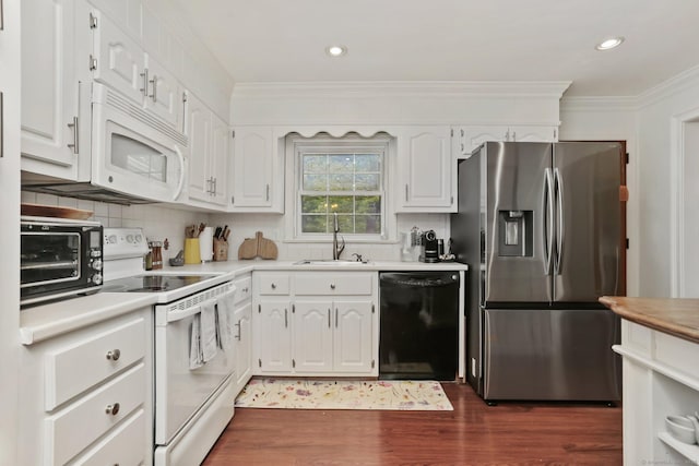 9 Cindy Ln, Norwalk, CT 06851 - kitchen featuring white appliances, a sink, ornamental molding, dark wood-style floors, and white cabinets