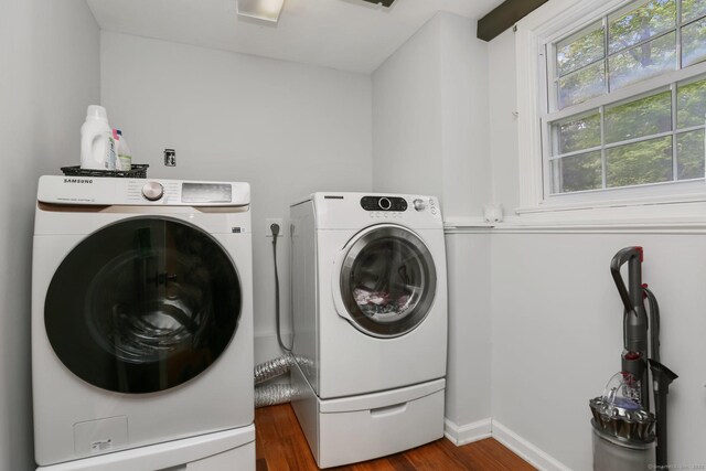 9 Cindy Ln, Norwalk, CT 06851 - laundry area featuring independent washer and dryer, wood finished floors, and baseboards