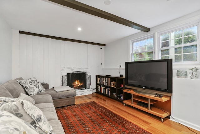 9 Cindy Ln, Norwalk, CT 06851 - living area with wood finished floors, a fireplace, and beam ceiling