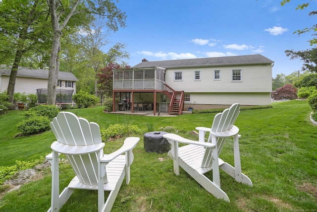 9 Cindy Ln, Norwalk, CT 06851 - back of house with a sunroom, a patio area, a lawn, and stairway