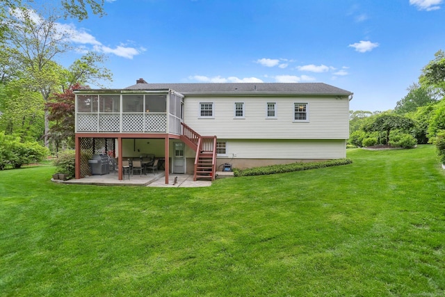 9 Cindy Ln, Norwalk, CT 06851 - rear view of property with a patio area, a sunroom, a lawn, and stairs
