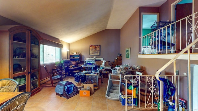 rec room with tile patterned floors and vaulted ceiling
