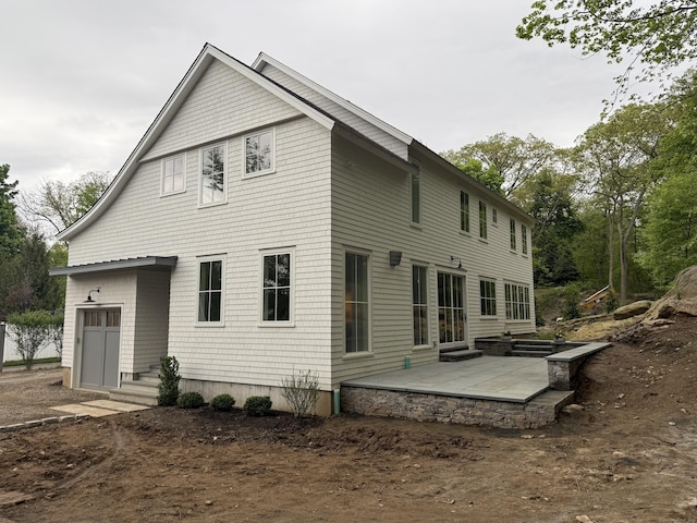 back of house with a patio area and entry steps