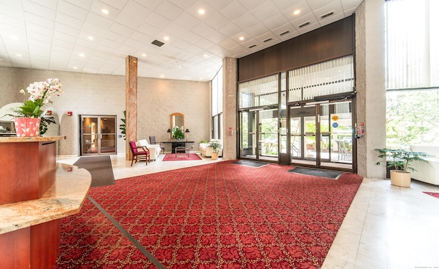 common area featuring a high ceiling and recessed lighting