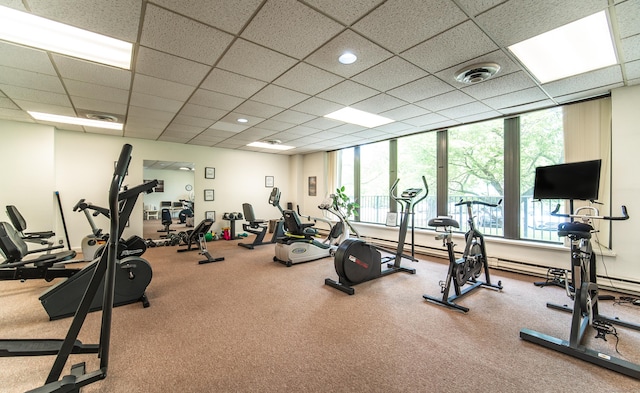 exercise room featuring a paneled ceiling